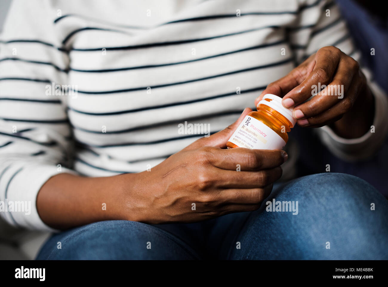 Woman taking pills for her health Stock Photo