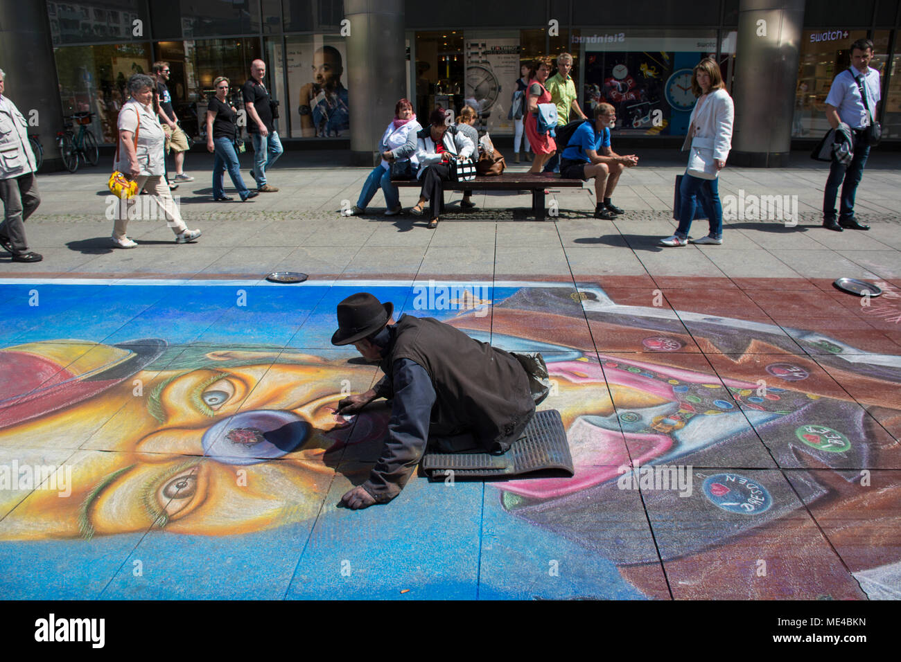 Artist painting on the ground in Dresden Saxony Germany Stock Photo