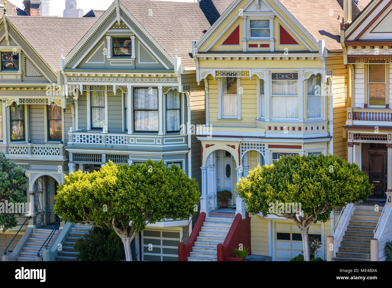 Beautiful view of Painted Ladies, colorful Victorian houses located near scenic Alamo Square in a row, on a summer day with blue sky, San Francisco, C Stock Photo