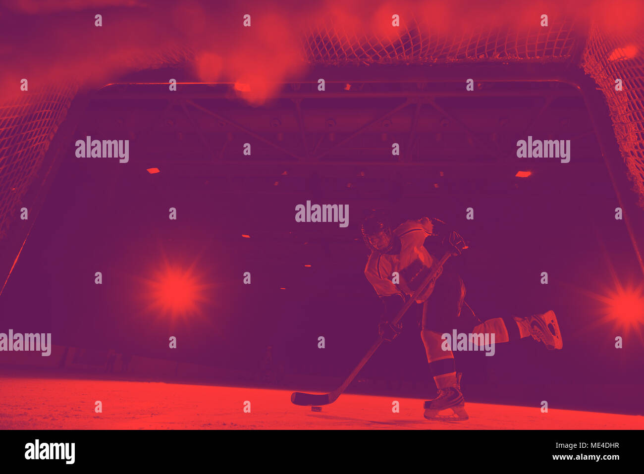 teen girl children ice hockey player in action kicking puck with stick