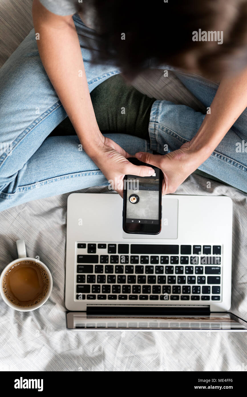 Woman posting coffee photo Stock Photo - Alamy