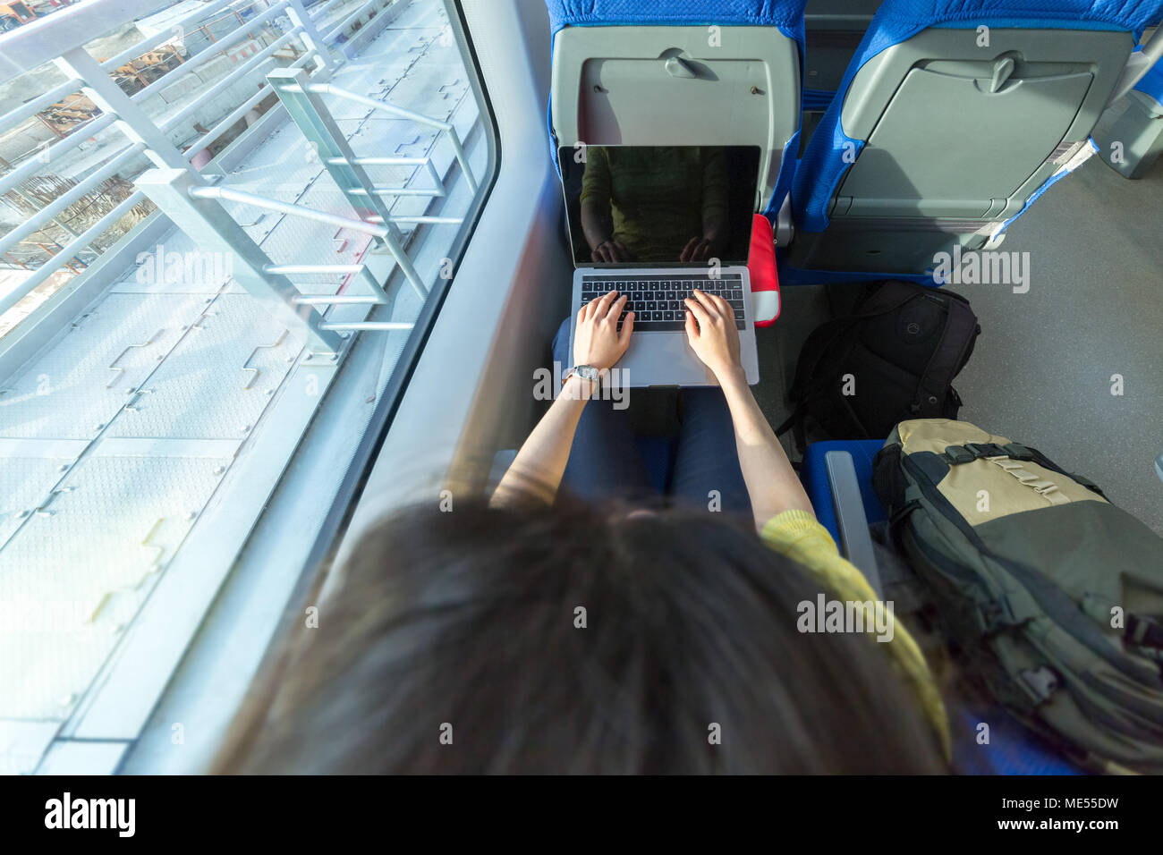 Woman commute train laptop hires stock photography and images Alamy
