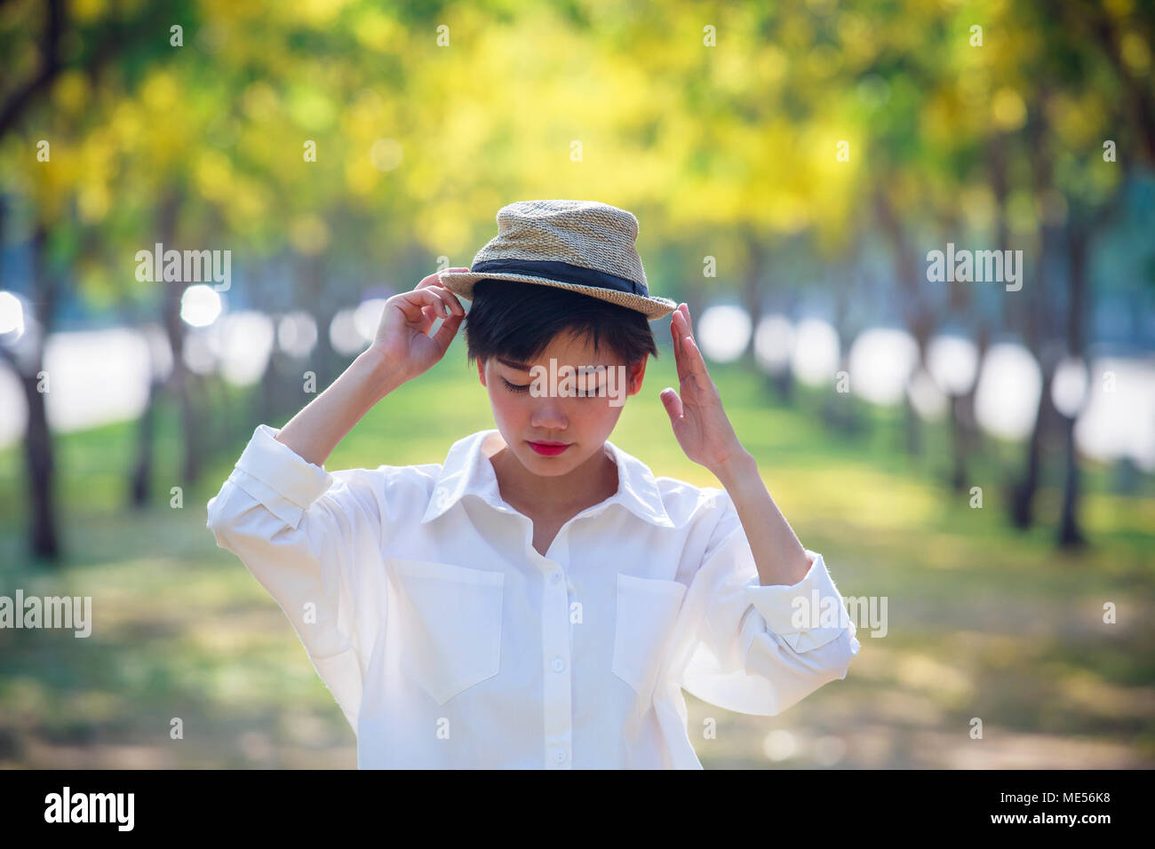 portrait of asian young beautiful woman wearing straw hat standing in ...