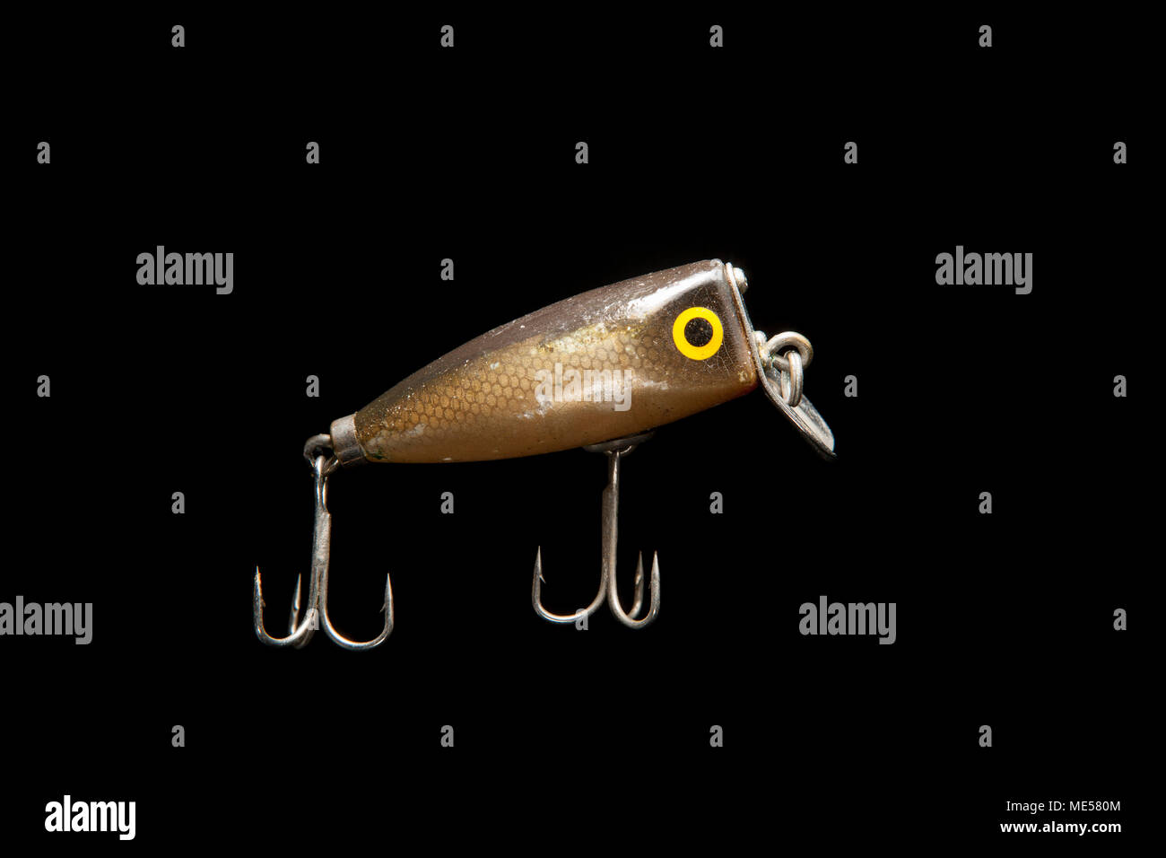 Fishing lures on a black background hi-res stock photography and