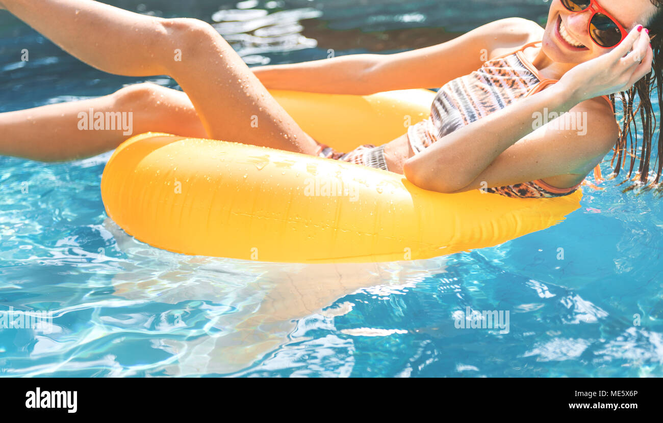 Girl cooling down in a swimming pool Stock Photo