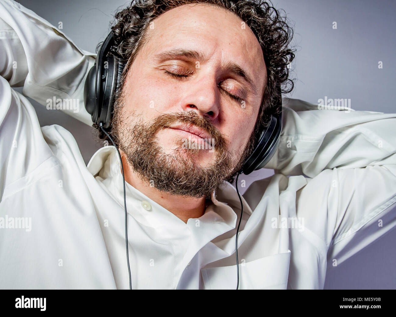 classical music, man with intense expression, white shirt Stock Photo