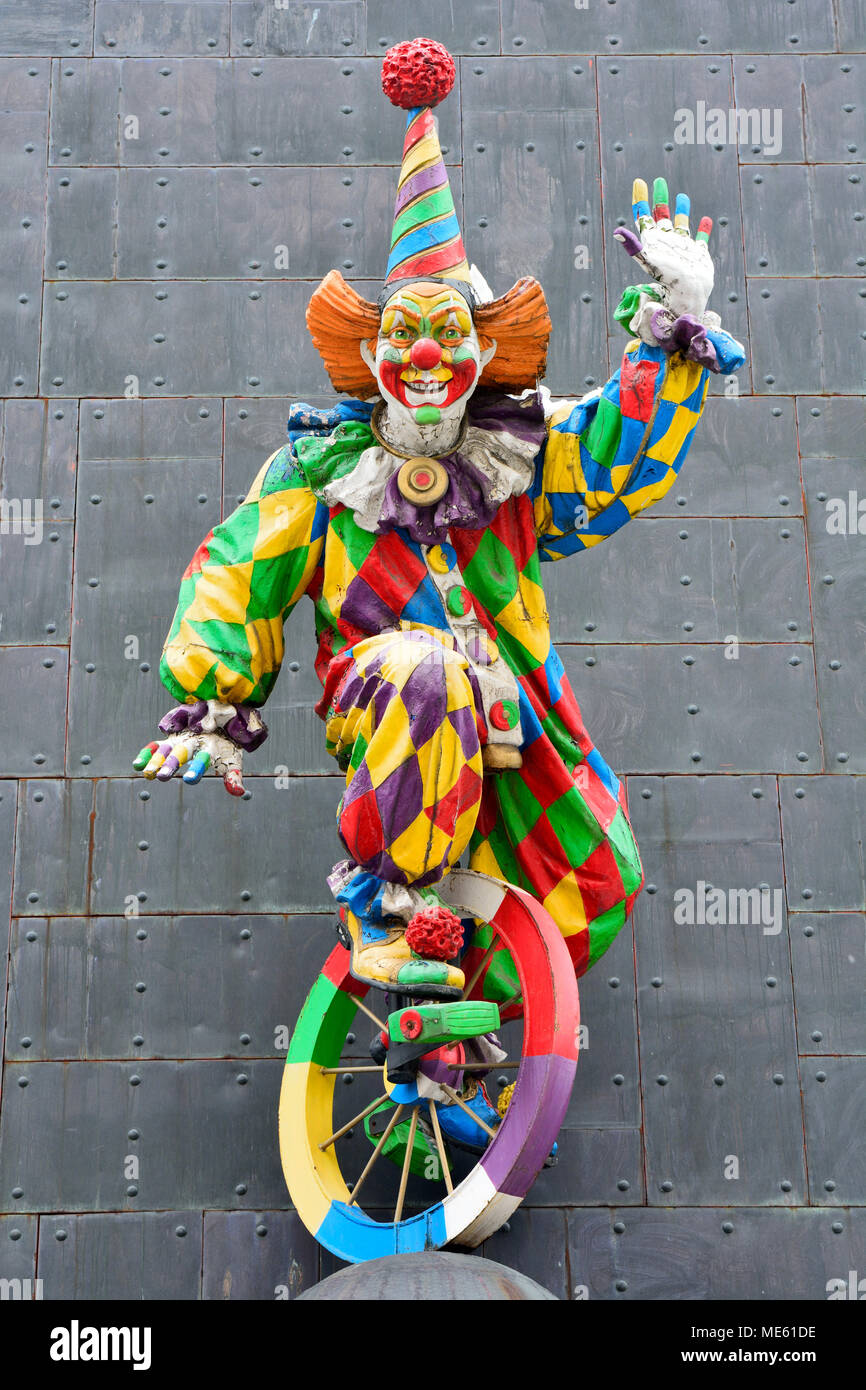 Moscow, Russia - March 22, 2018. Colorful sculpture of clown on the facade of Tsereteli museum building in Moscow. Stock Photo