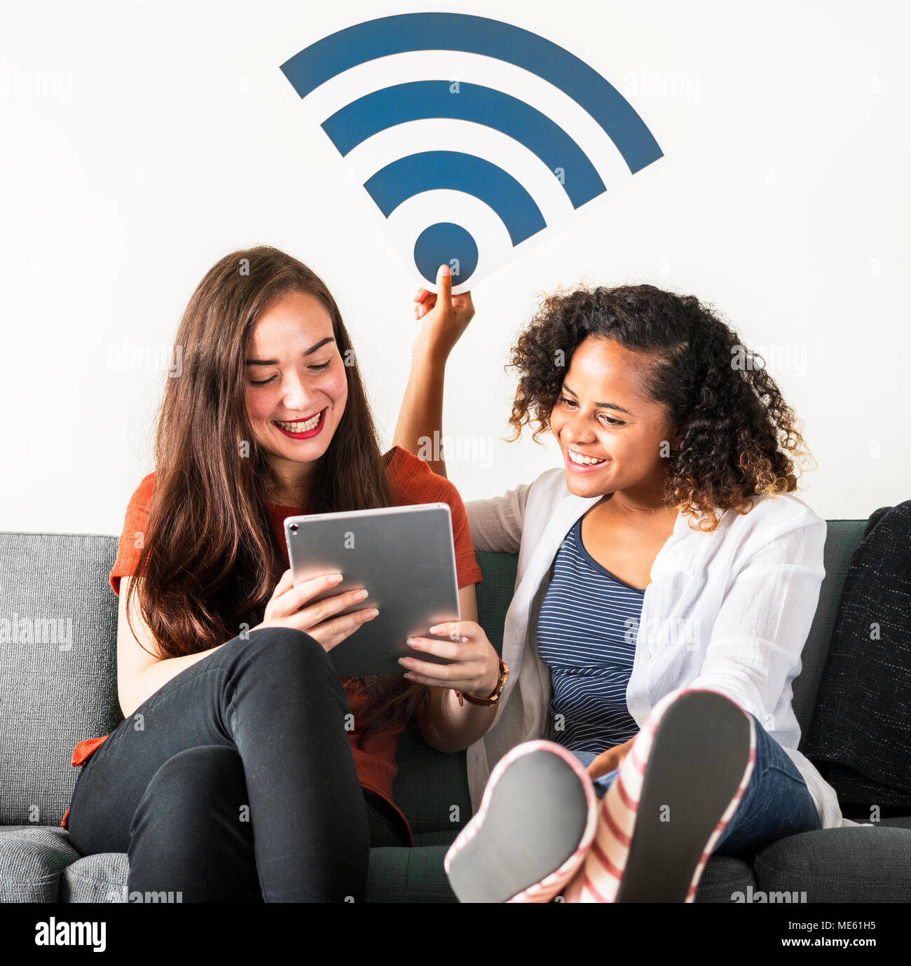 Friends with wifi signal icon Stock Photo