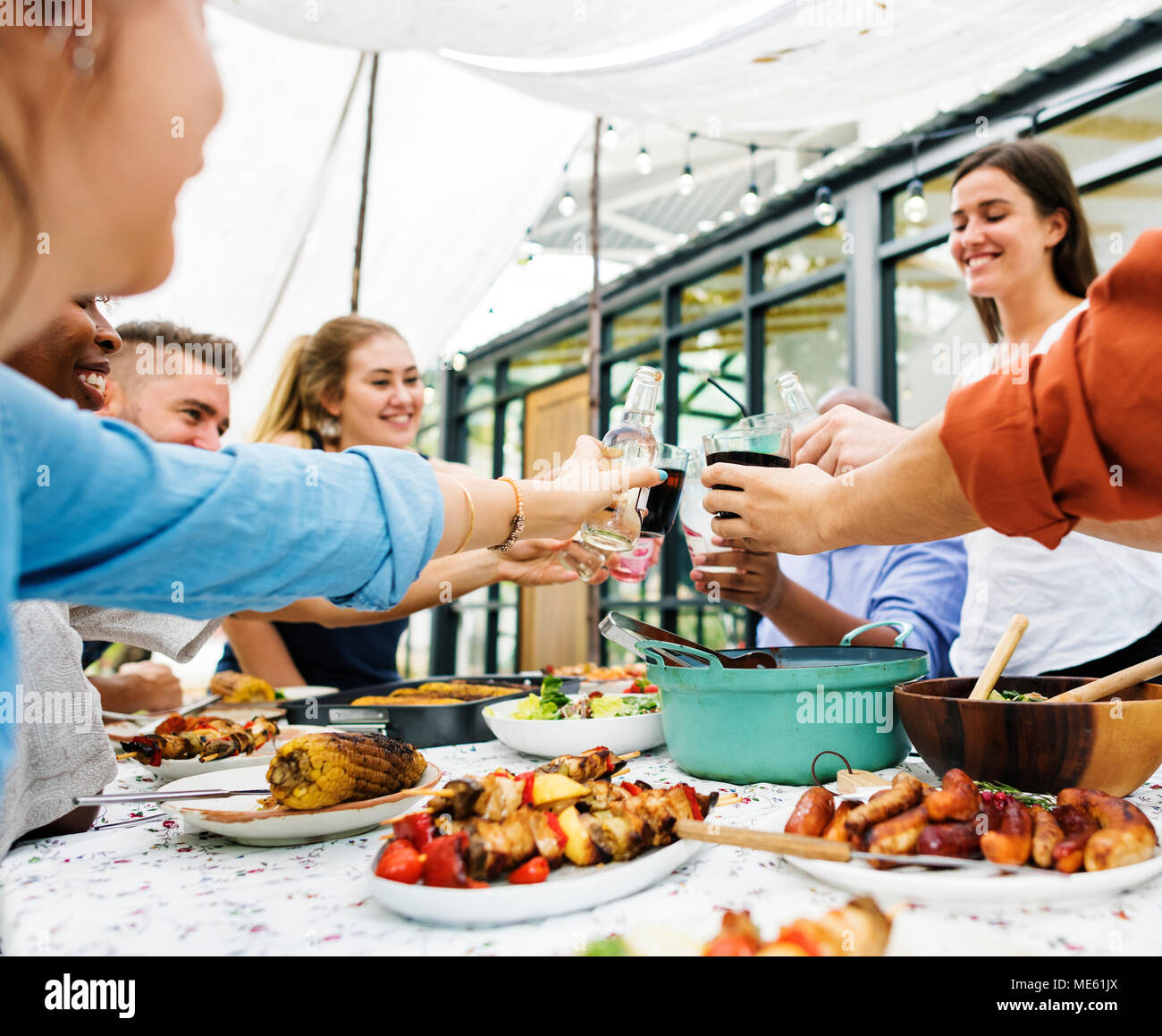 Group of diverse friends enjoying summer party together Stock Photo
