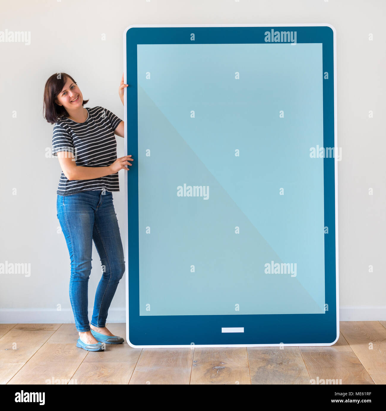 Woman holding a blue tablet mockup Stock Photo