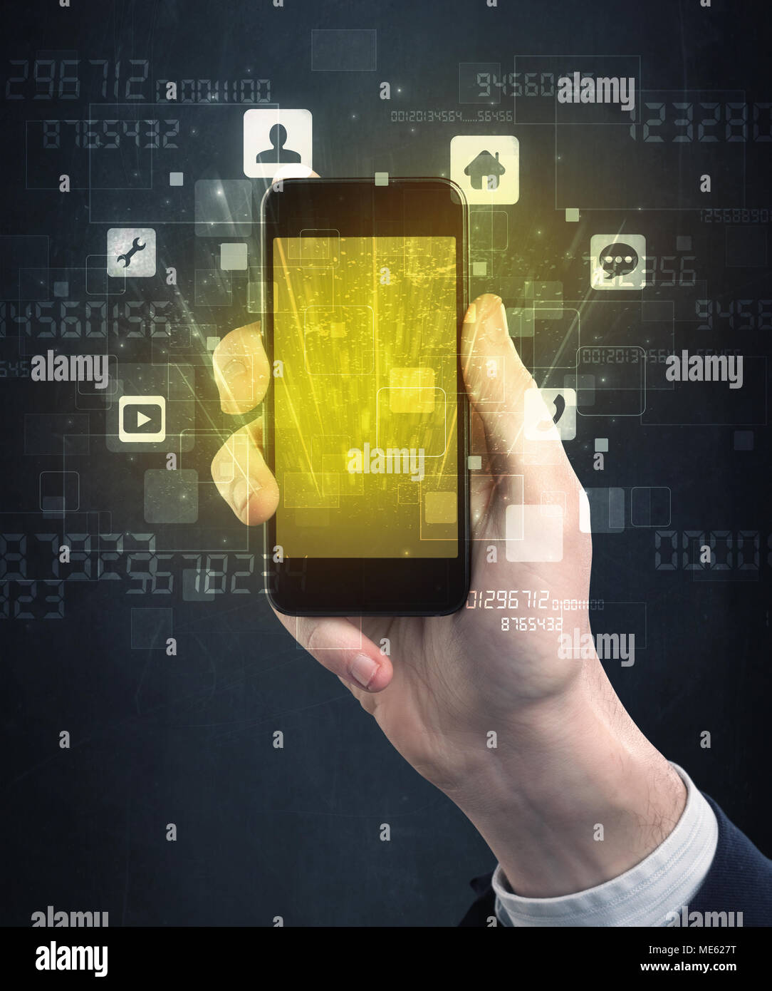 Caucasian hand in business suit holding a smartphone with golden-yellow ...