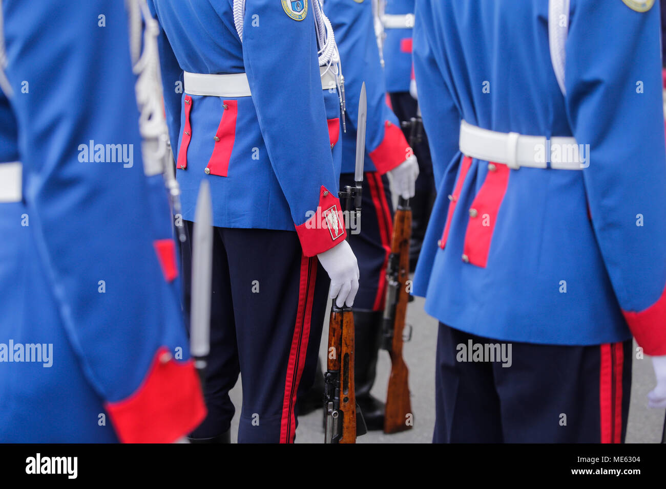 Parade soldiers wait with their guns on the ground for an event to ...