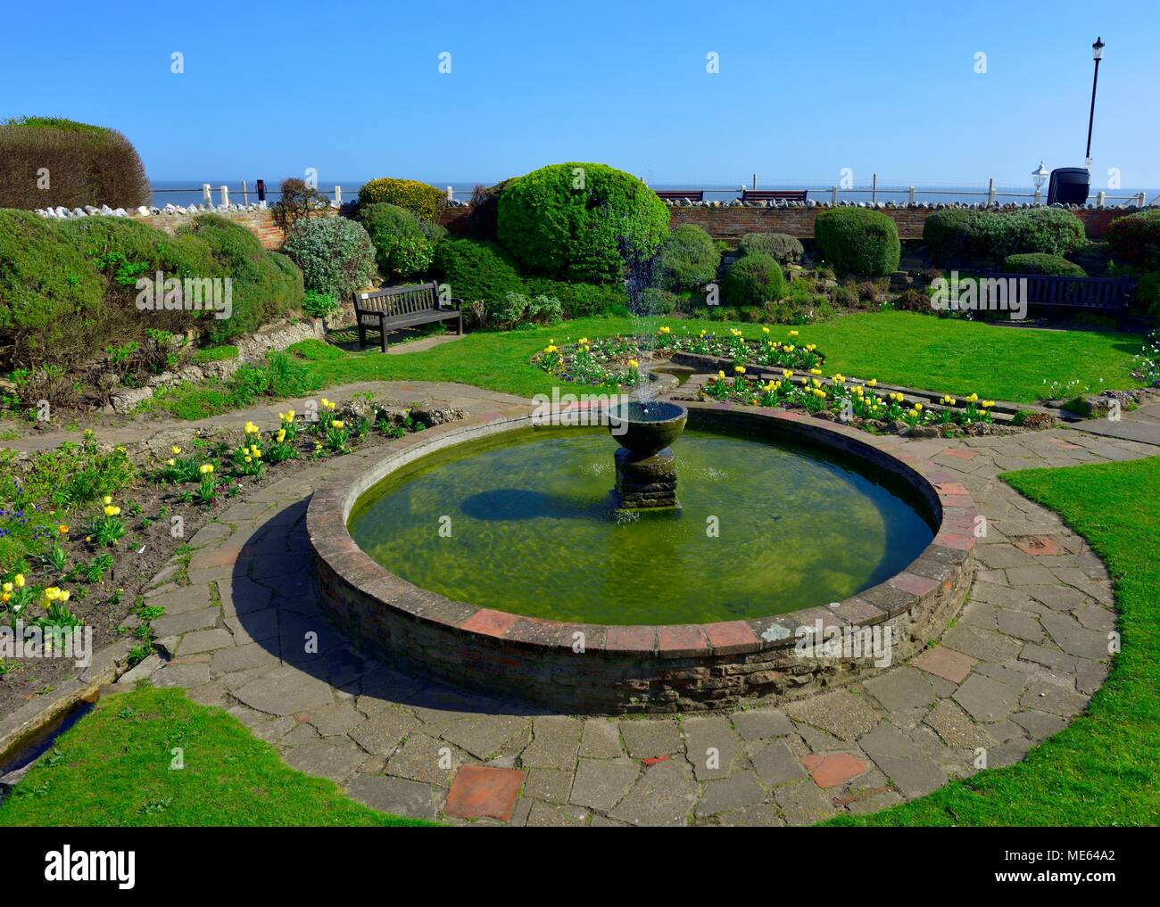 Small Fountain in the sea front gardens Cromer Norfolk England UK Stock Photo