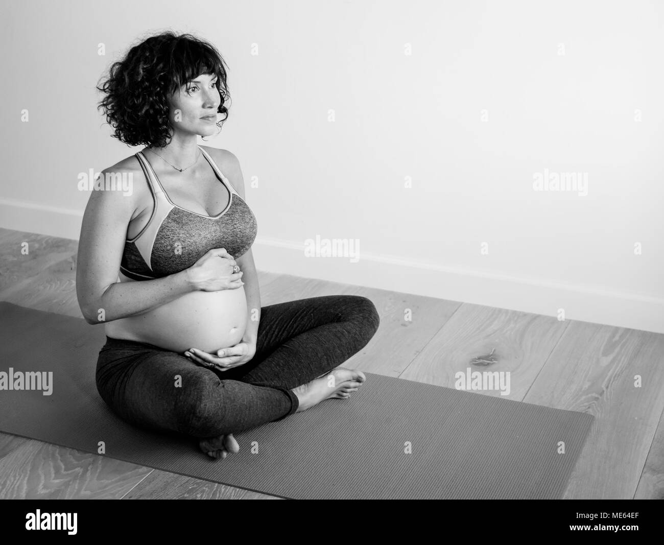 Pregnant woman doing light exercise Stock Photo