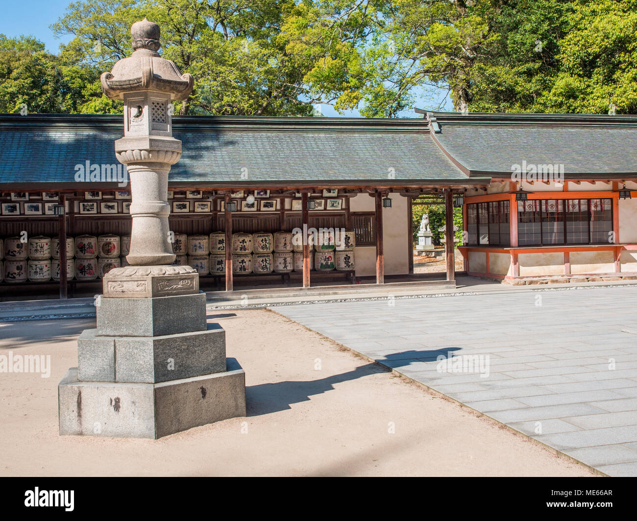 Ishidoro stone lantern and offerings of sake barrels, Ōyamazumi Jinja, , Omishima island,  Seto Inland Sea, Japan Stock Photo