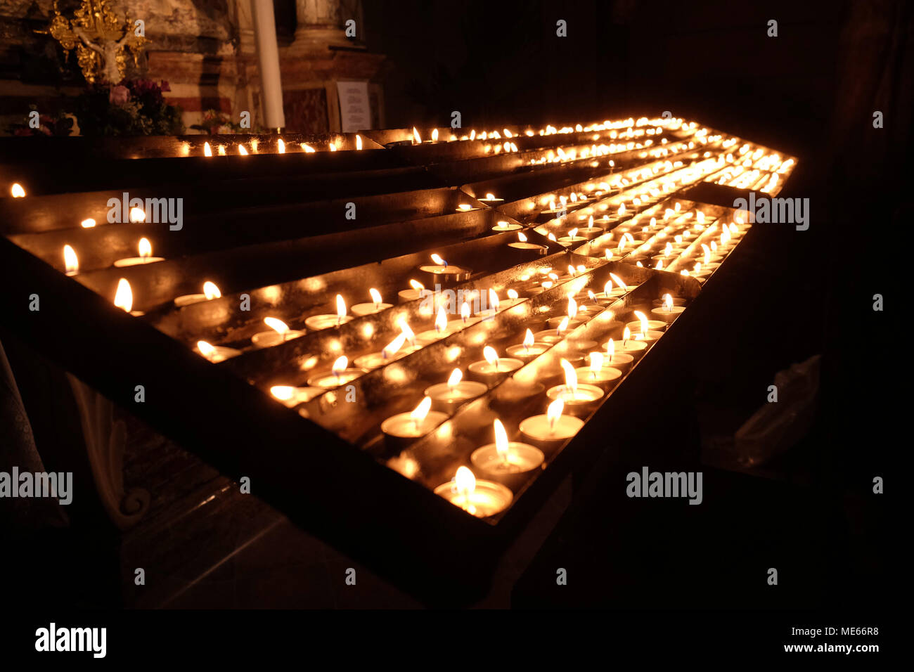 Lit candles on the altar of Our Lady in the Cathedral of the Assumption