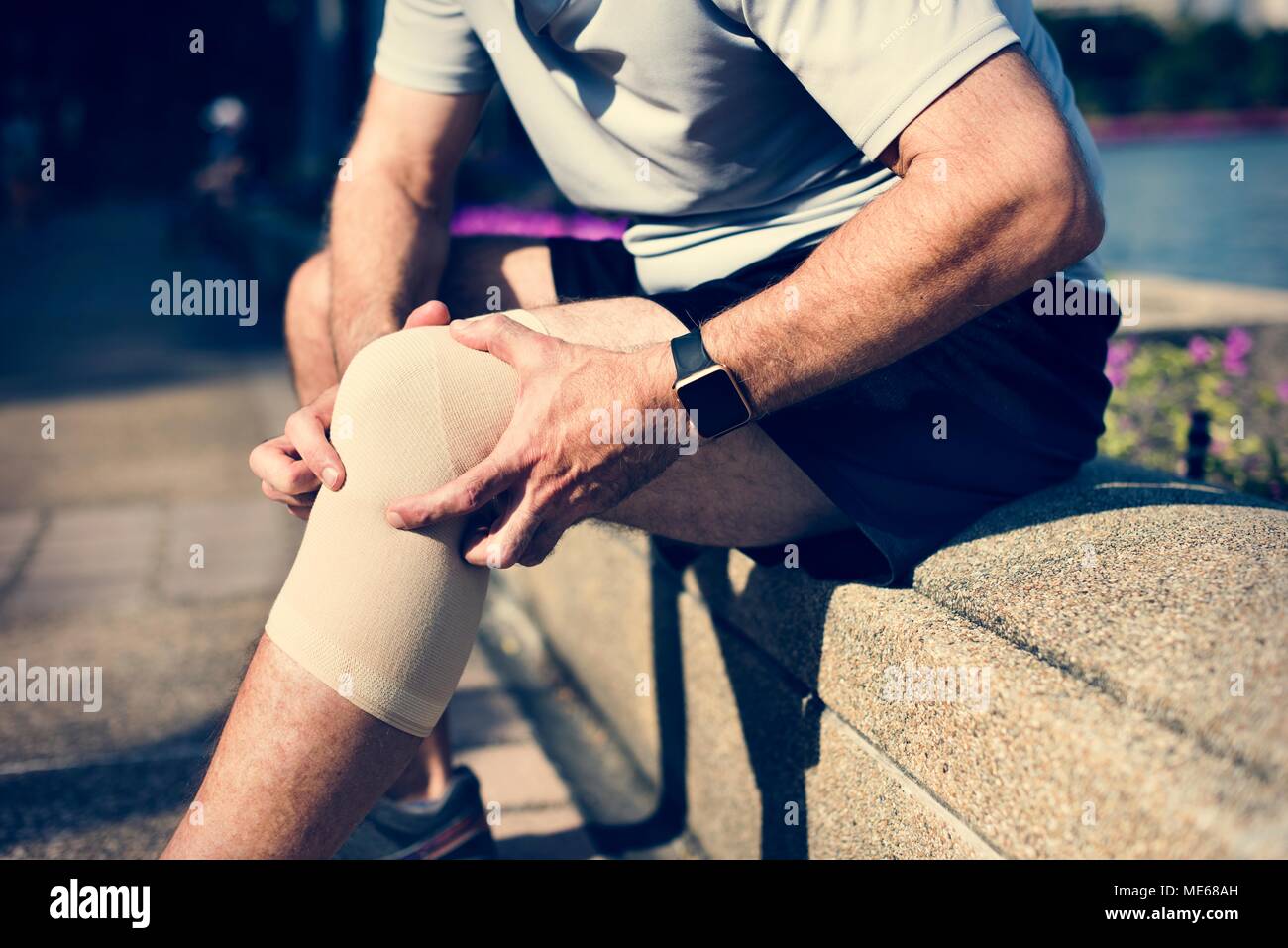 Elderly man having a knee injury Stock Photo