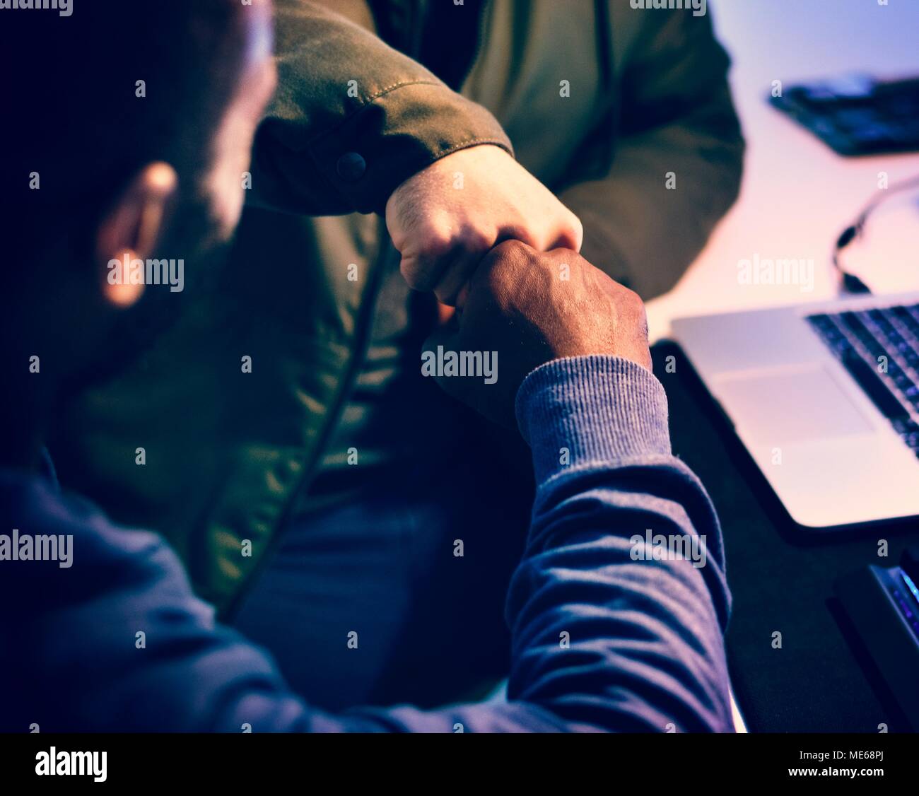 Closeup of friends bumped their fists together Stock Photo
