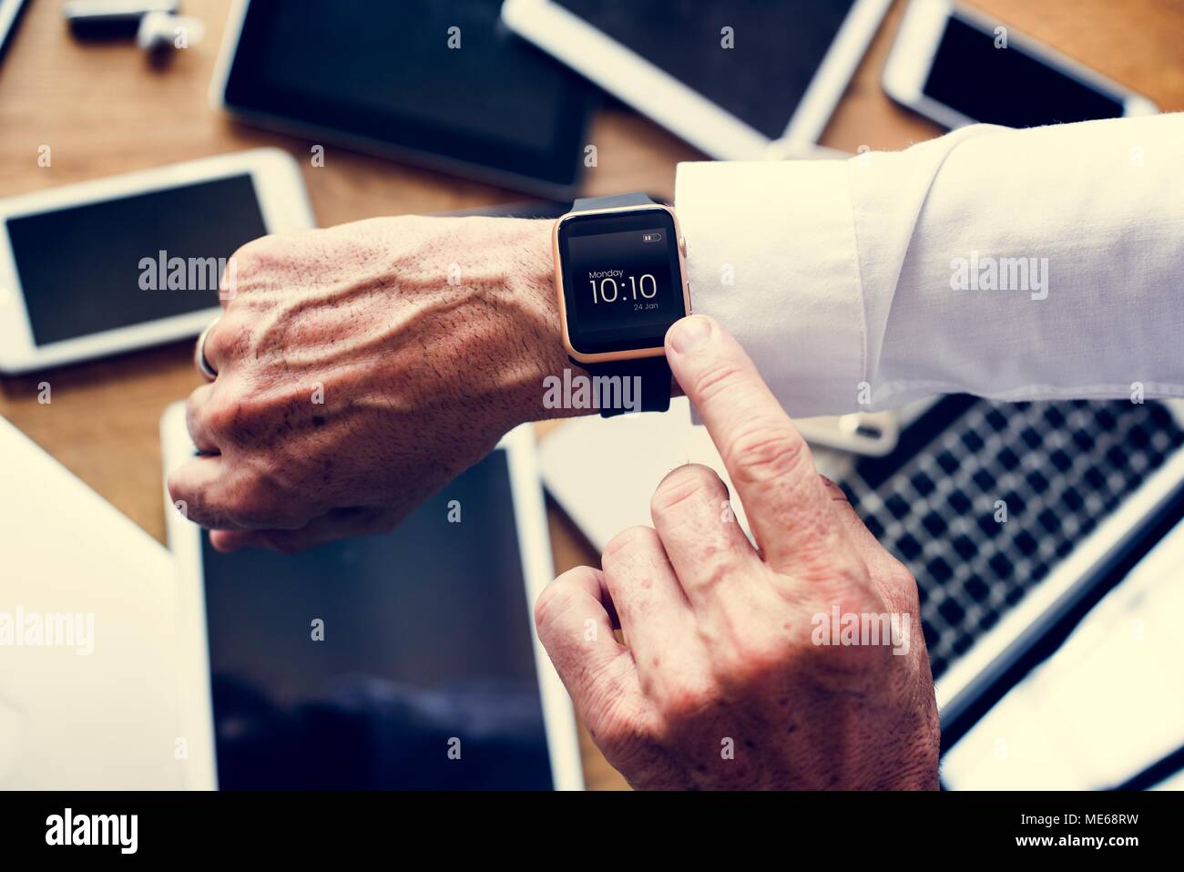 Businessman checking his smart watch Stock Photo