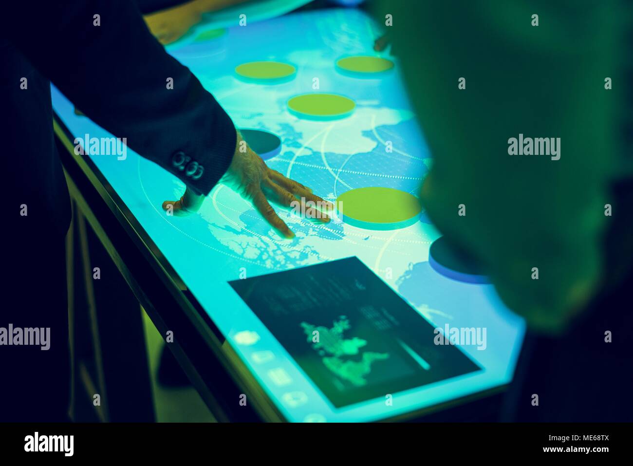 Hands point a cyber space diagram table in a meeting Stock Photo