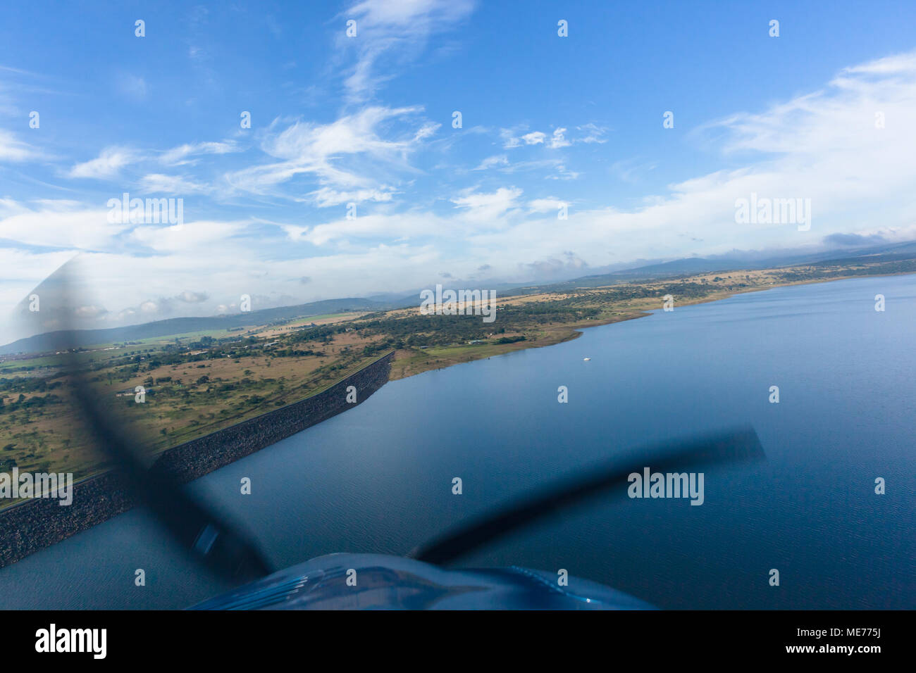 Flying low birds-eye overlooking Albert Falls Dam and surrounding ...