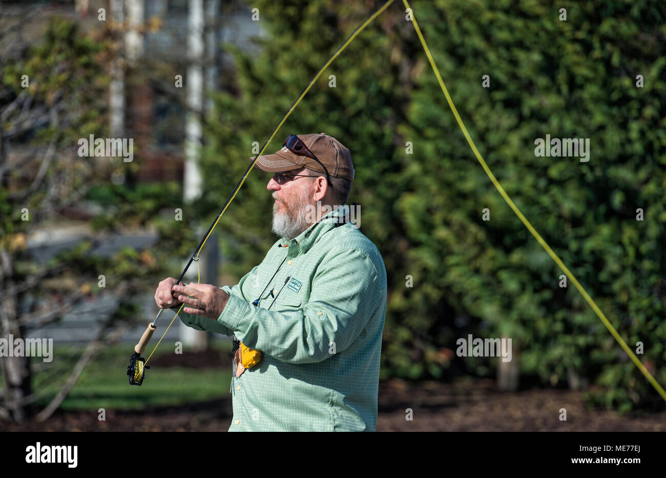 UNITED STATES: April 21, 2018: Scott Allen, fishing manager at Orvis talks with students about casting technics with fly rods at the store in Leesburg Stock Photo