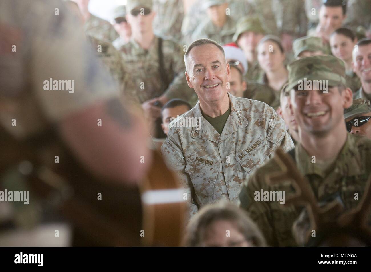 U.S. Joint Chiefs of Staff Chairman Joseph Dunford watches country music singer Jerrod Niemann perform for U.S. soldiers during the USO Holiday Tour at Camp Taji December 25, 2017 in Taji, Iraq.   (photo by Dominique A. Pineiro via Planetpix) Stock Photo