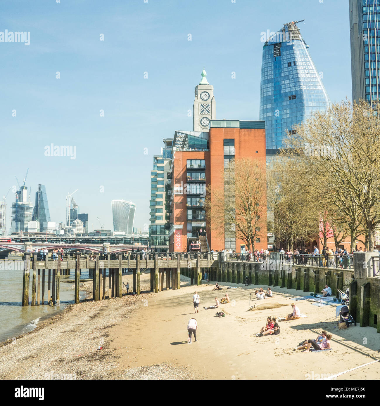 Beach on the River Thames with the OXO Tower behind, London. Stock Photo