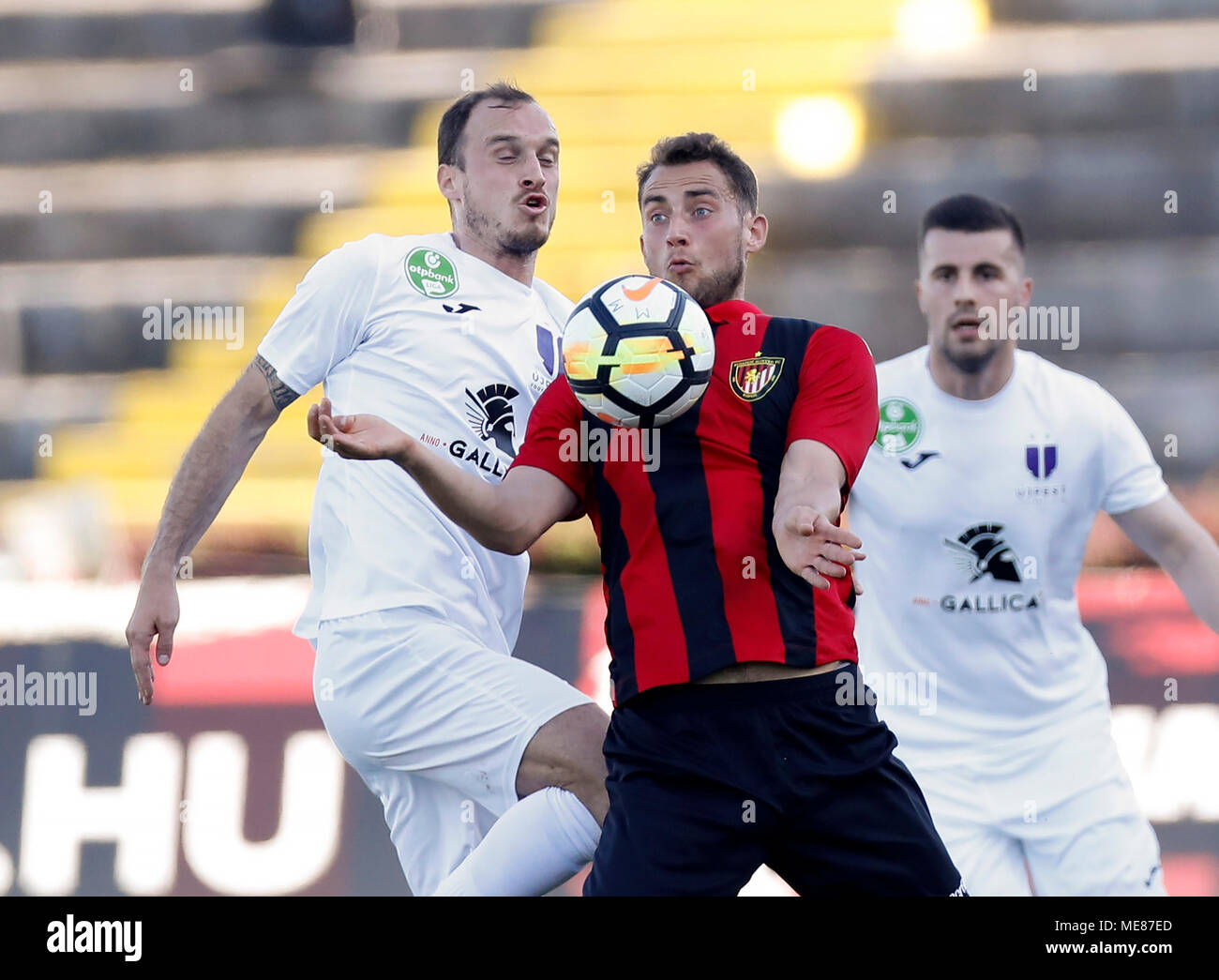 Budapest, Hungary. 21st April, 2018. (l-r) Robert Litauszki of Ujpest FC competes for the ball with Marton Eppel of Budapest Honved in front of Dzenan Burekovic of Ujpest FC during the Hungarian OTP Bank Liga match between Budapest Honved and Ujpest FC at Bozsik Stadium on April 21, 2018 in Budapest, Hungary. Stock Photo