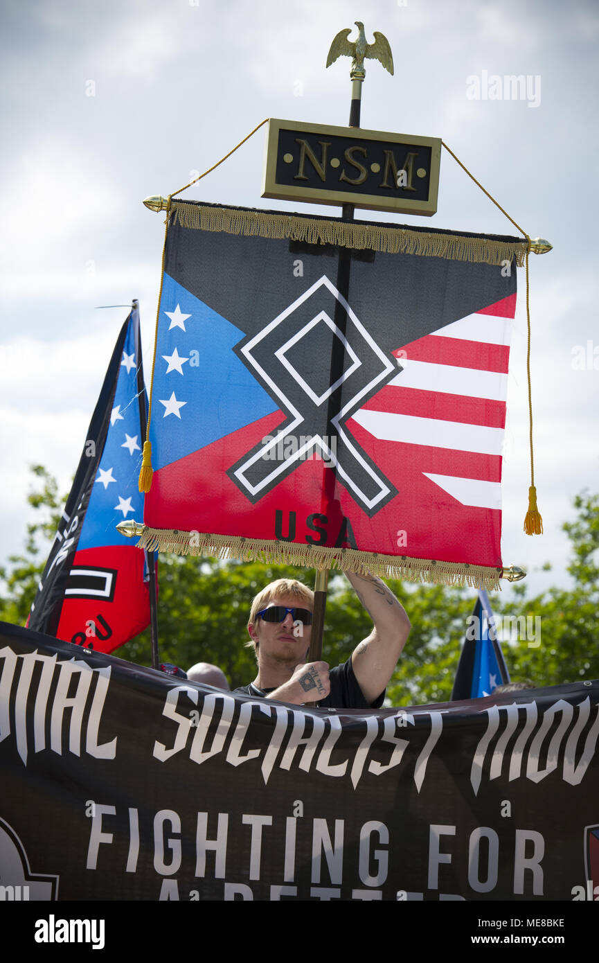 Newnan, Georgia, USA. 21st Apr, 2018. An estimated 35 white supremacists gather for a neo-Nazi rally in a small Georgia town, surround by by hundreds of law enforcement personnel and hundreds of anti-white supremacist protesters Credit: Robin Rayne Nelson/ZUMA Wire/Alamy Live News Stock Photo