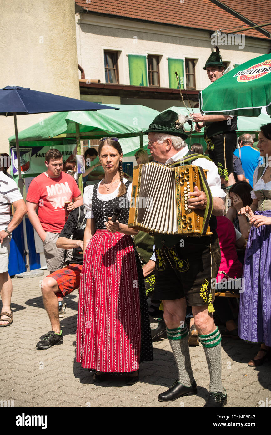 Neuoetting, Germany. 21 April 2018. A man in typical bavarian clothes plays the accordeon Stock Photo