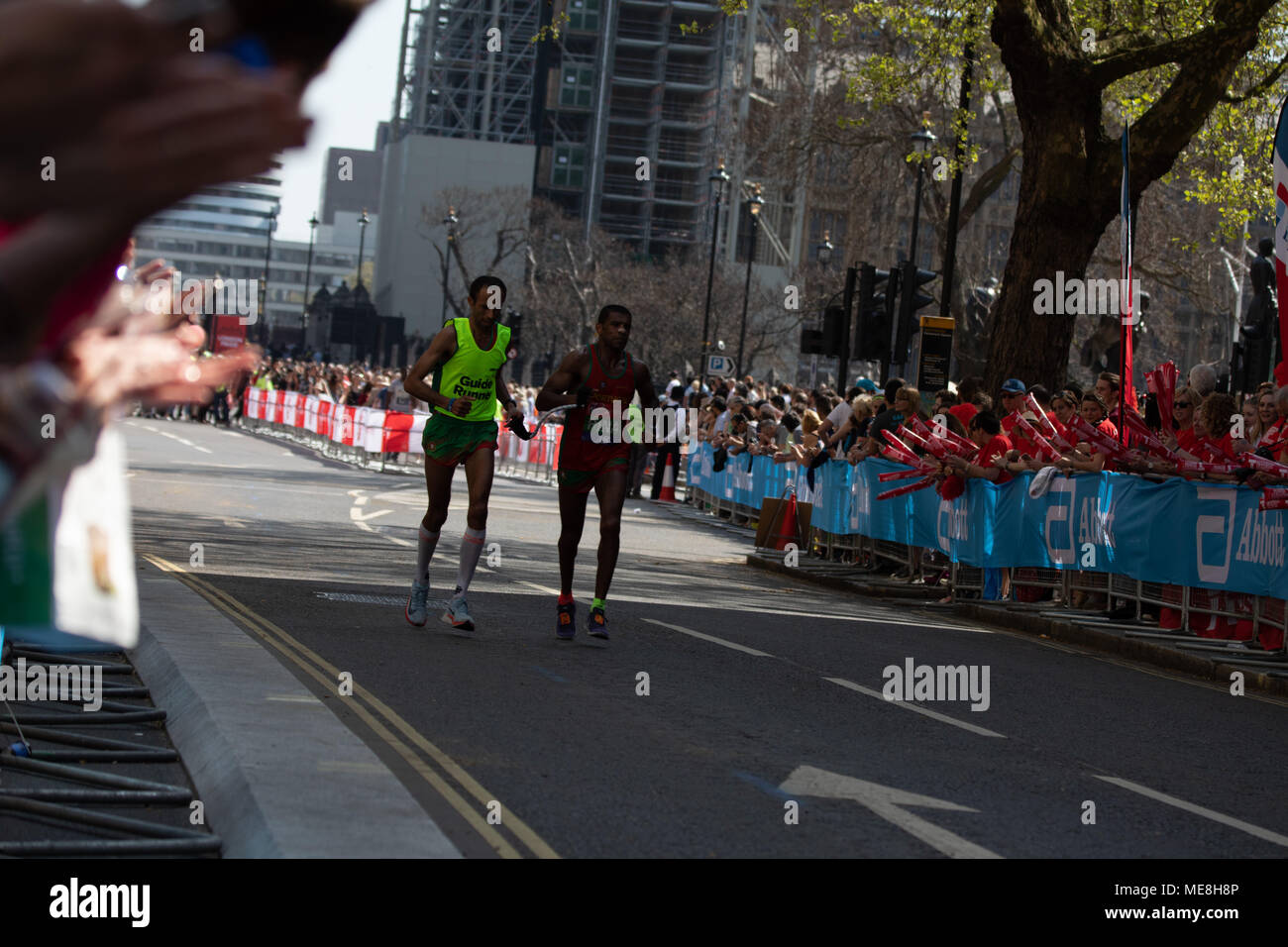 London, UK, 22nd April 2018: Virgin Money London Marathon 2018. Visually impared contestant running with his guide runner for Victory. Credit: Wojtek Ogrodnik/Alamy Live News Stock Photo