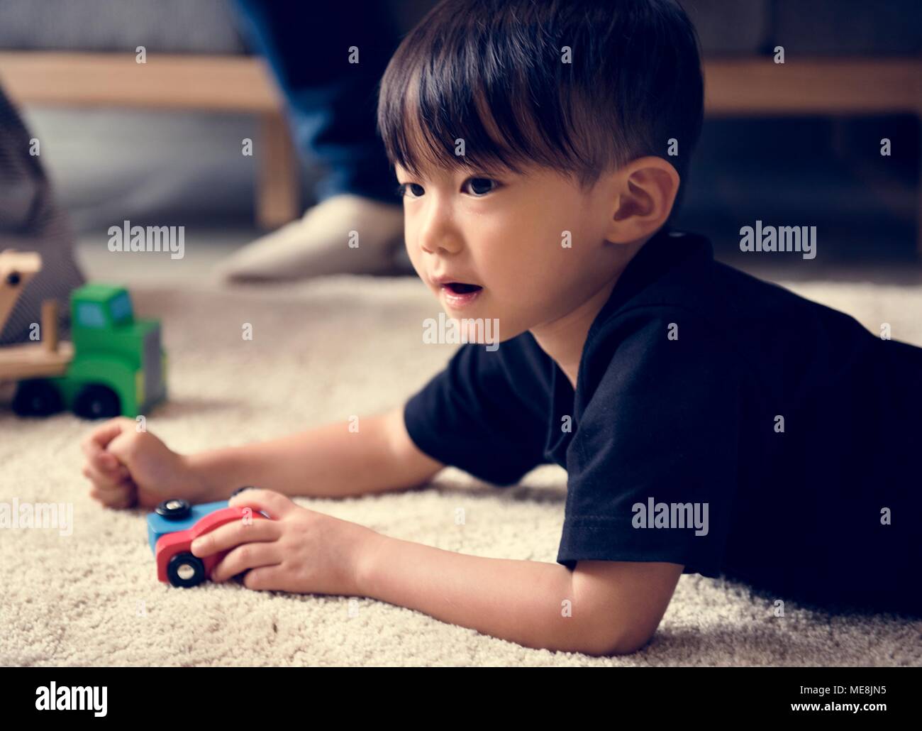 Young asian boy innocence adorable playing toy Stock Photo