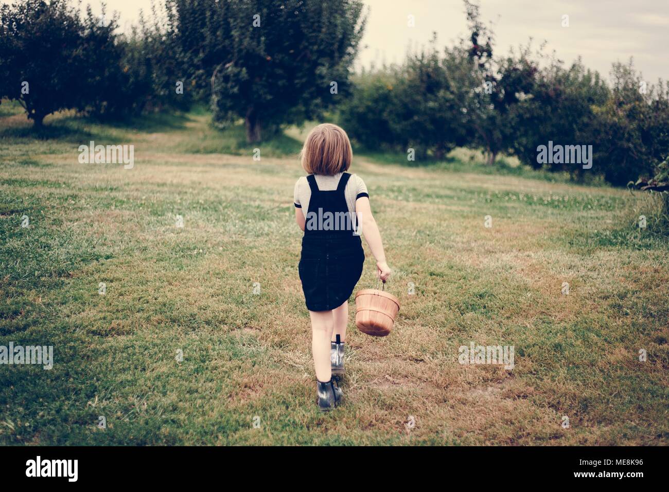 Little girl playing in a farm Stock Photo - Alamy