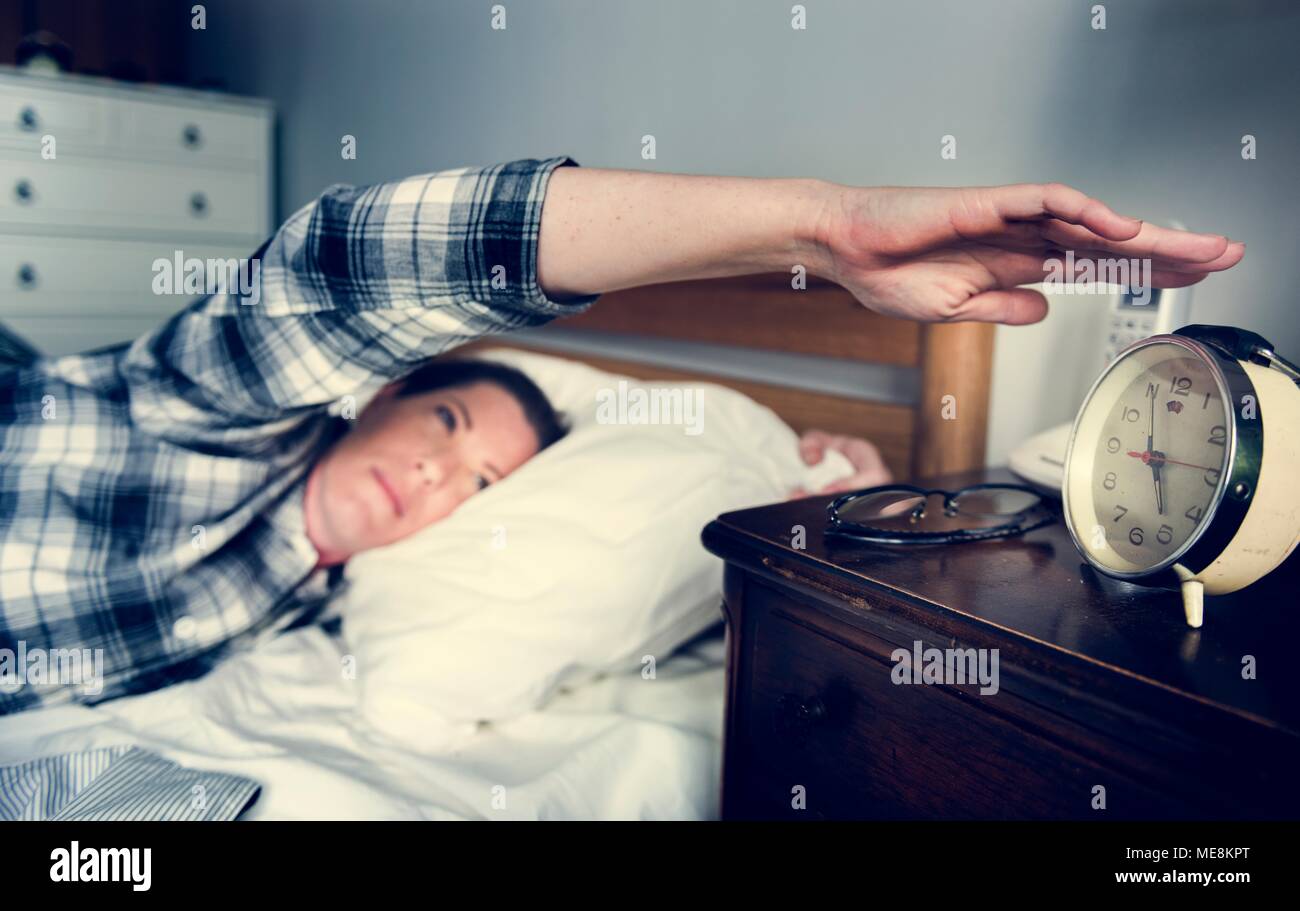 A woman waking up Stock Photo