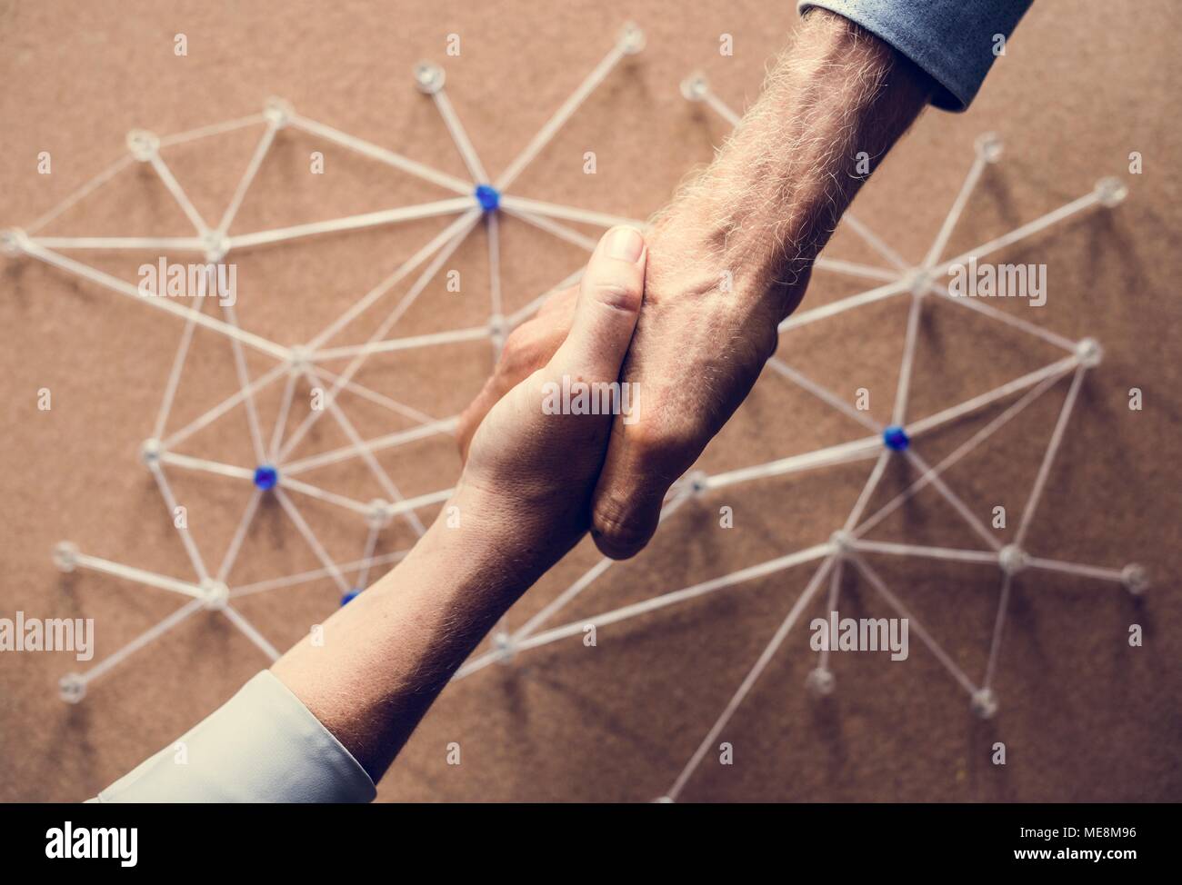 Handshake connecting over network simulation Stock Photo