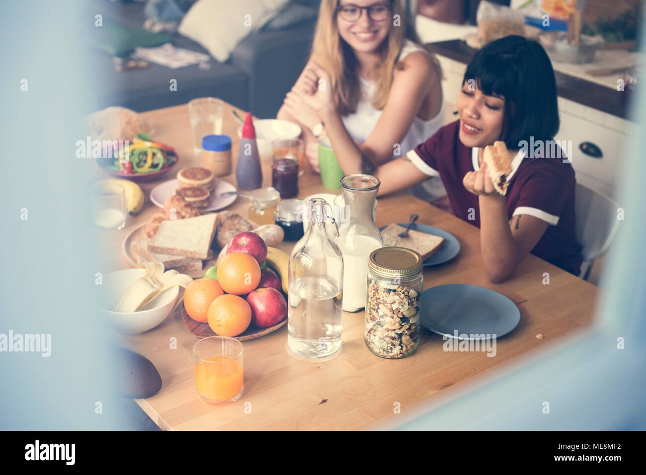 A group of diverse women having breakfast together Stock Photo
