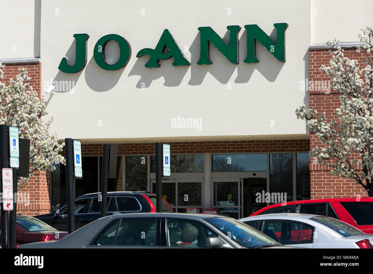 A logo sign outside of a JoAnn Fabrics retail store location in