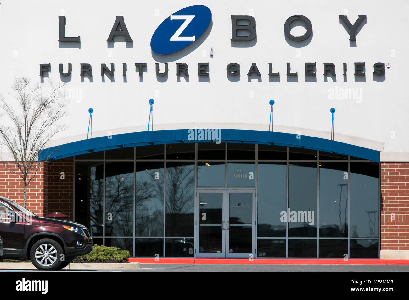 A Logo Sign Outside Of A La Z Boy Retail Store Location In