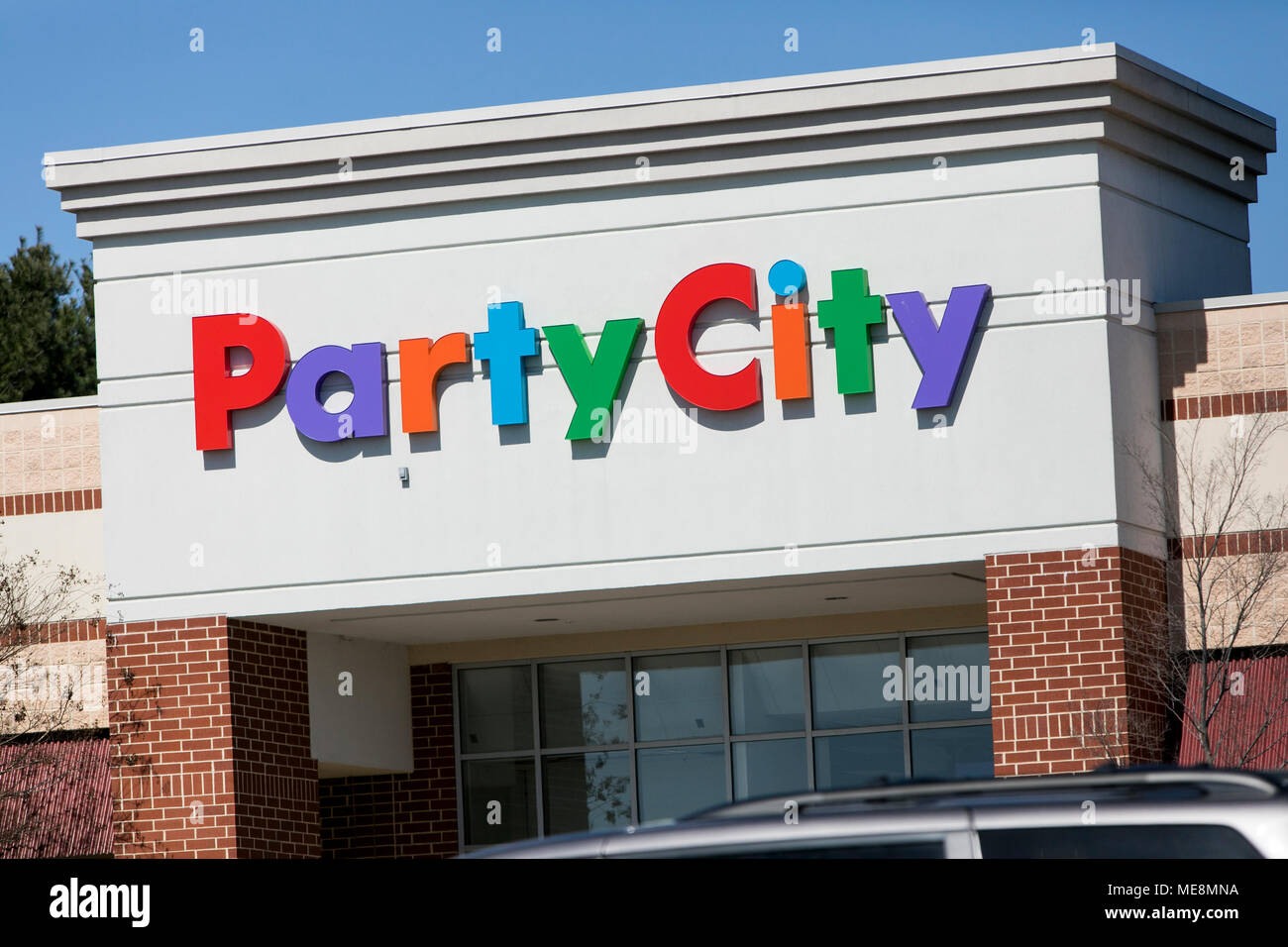 A logo sign outside of a Party City retail store location in Columbia, Maryland on April 20, 2018. Stock Photo