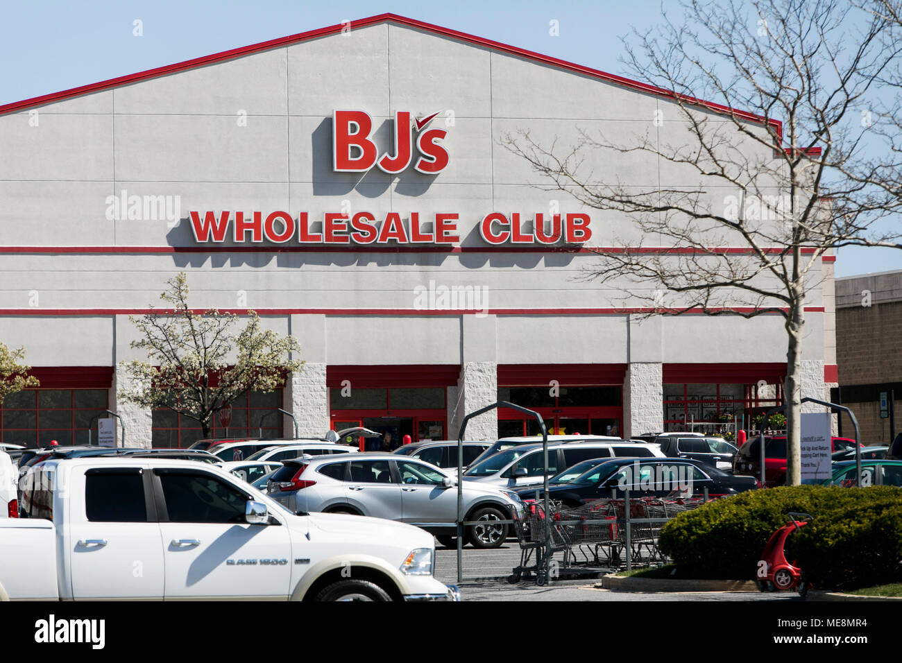 A logo sign outside of a BJ's Wholesale Club retail store location in
