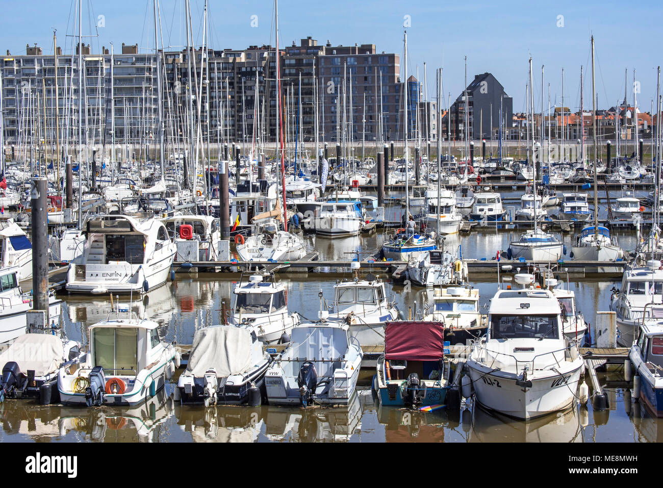 Sailing boats, motorboats and pleasure yachts in the marina at seaside resort Blankenberge along the North Sea coast, West Flanders, Belgium Stock Photo