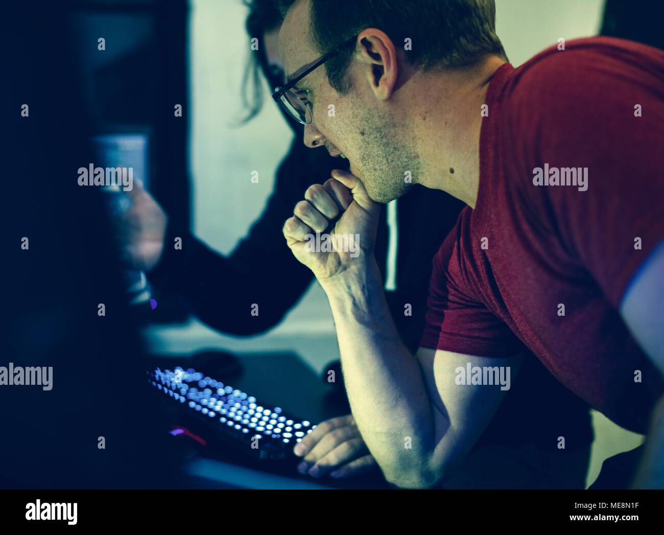 Programmers working on computer program Stock Photo