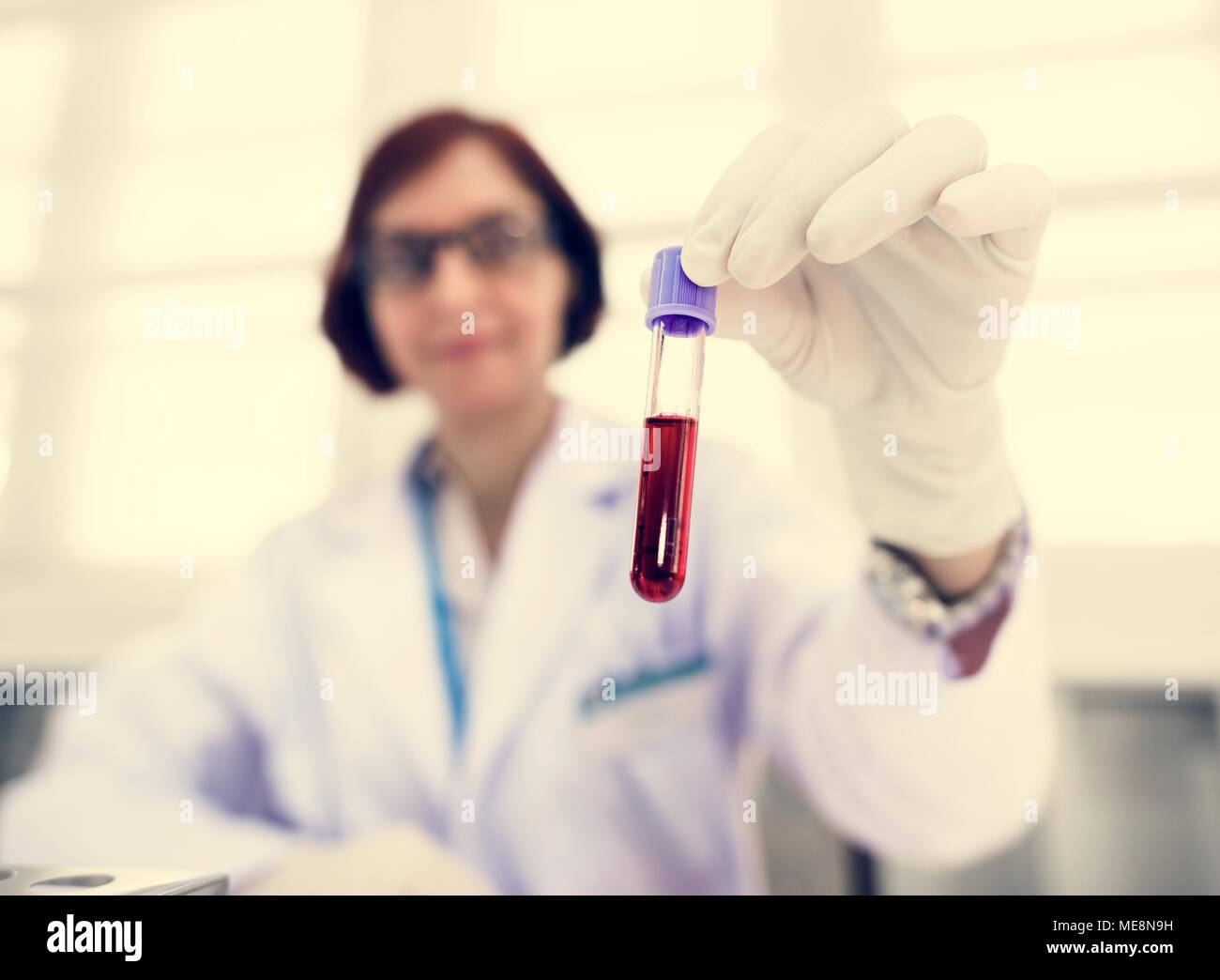Doctor holding blood sample Stock Photo