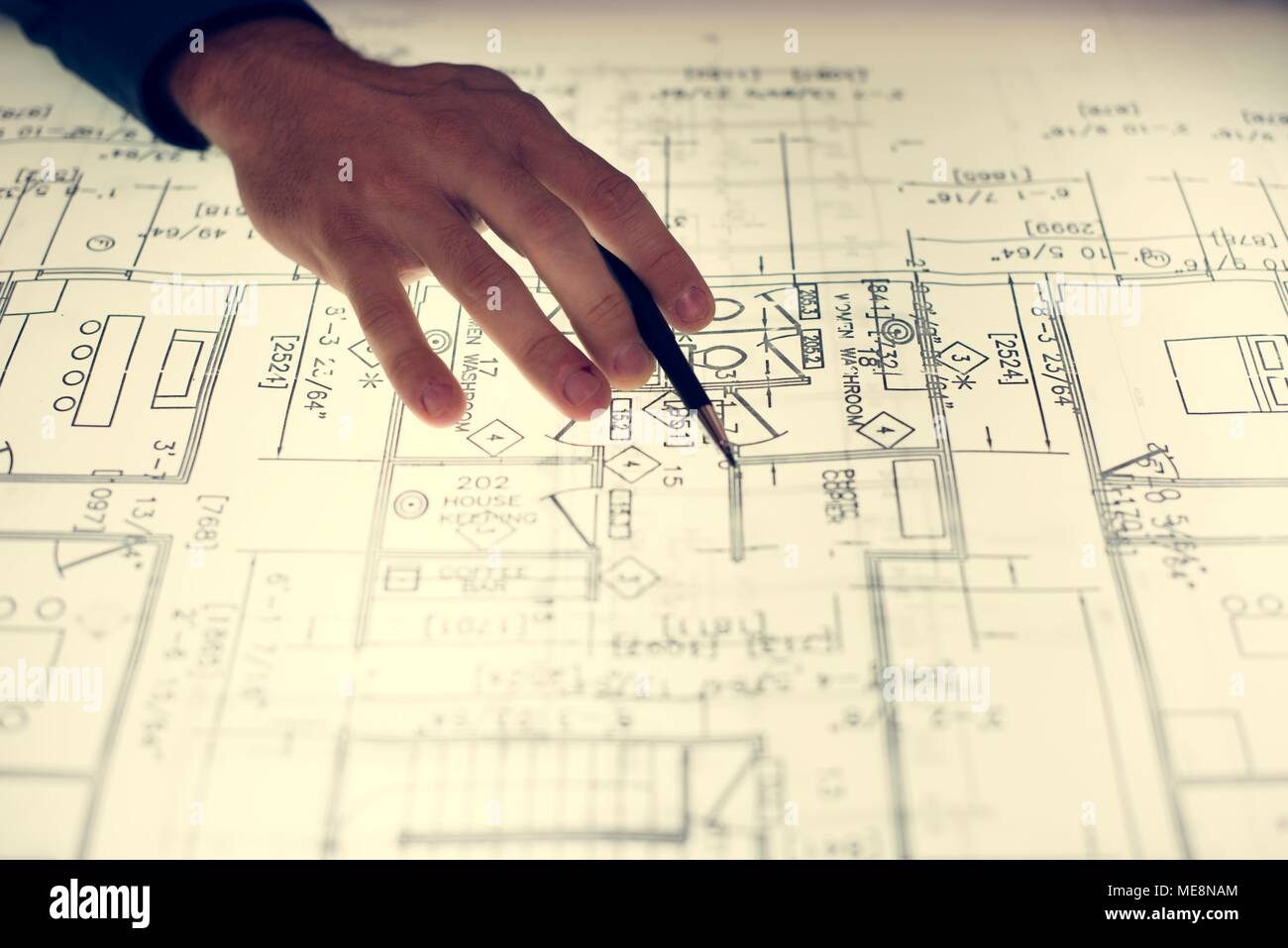 Close up of hands working on layout Stock Photo