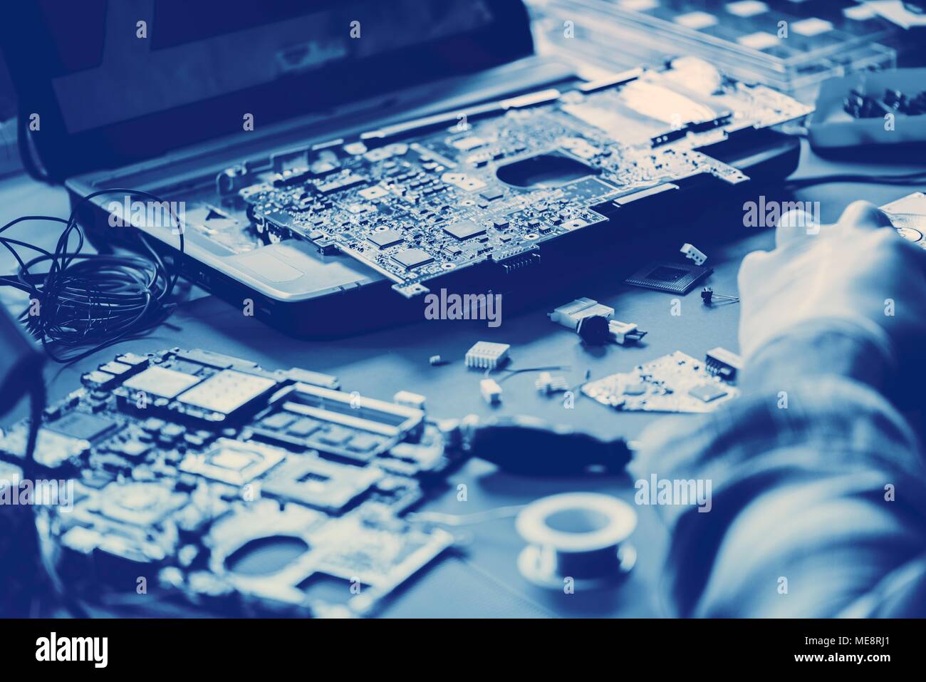Technicians working on computer mainboard Stock Photo - Alamy