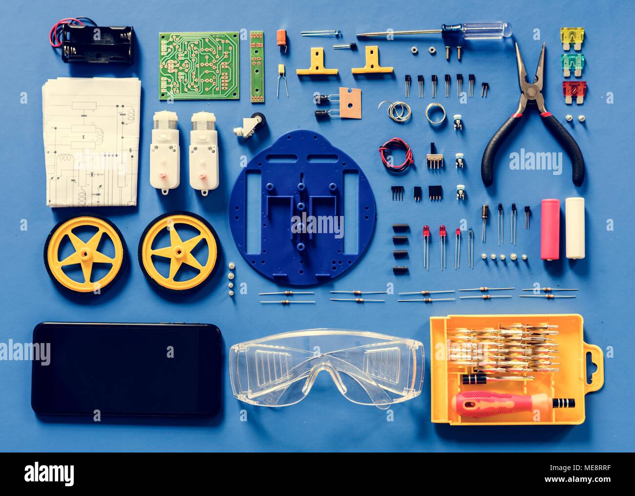 Aerial view of electronics tools equipments on blue background Stock Photo
