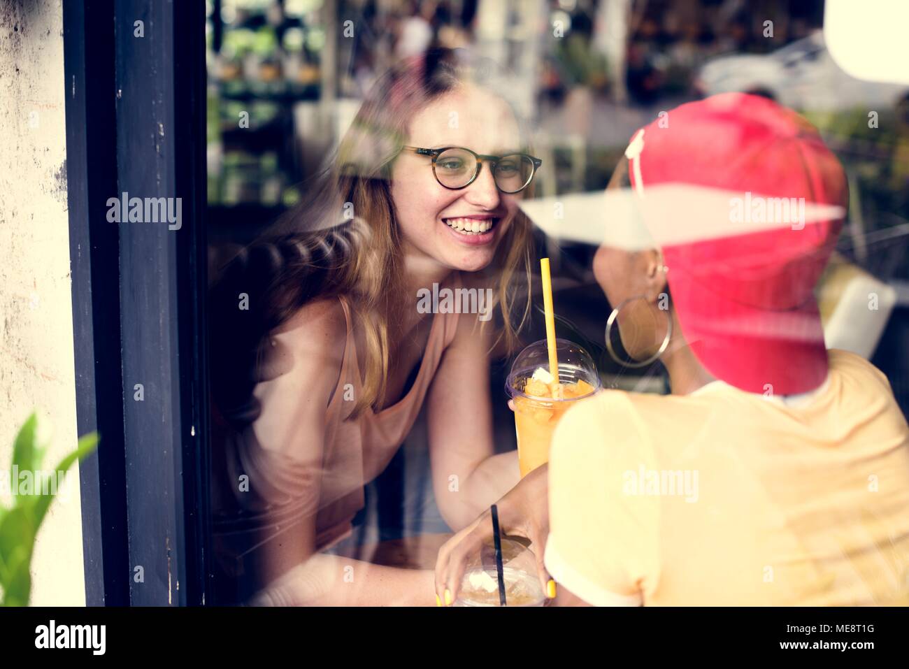 Women couple enjoying the time in the cafe Stock Photo