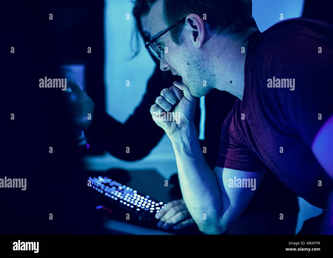 Programmers working on computer program Stock Photo