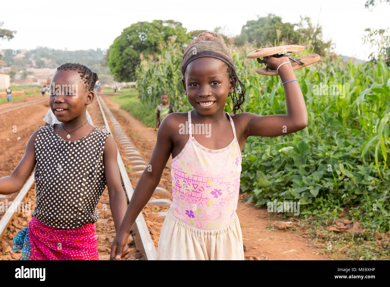 smiling-ugandan-girls-on-a-railway-track-in-a-rural-area-in-uganda